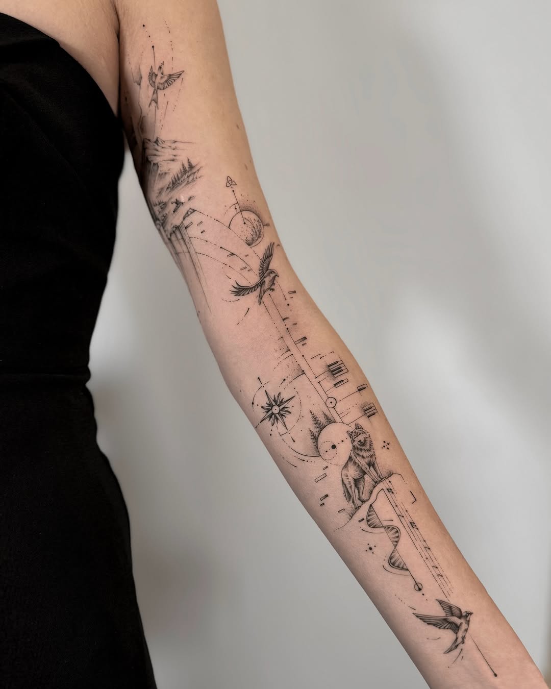 Cosmic-Inspired Fine Line Tattoo Design