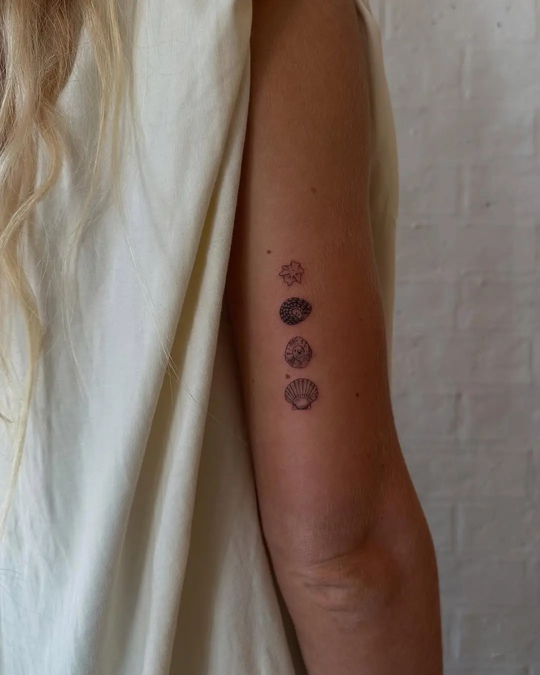 Minimalist Fine Line Tattoo Collection on Arm