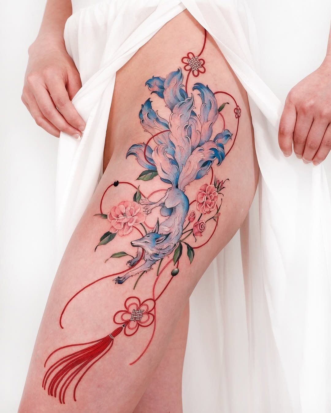 Stunning floral dragon tattoo on thigh