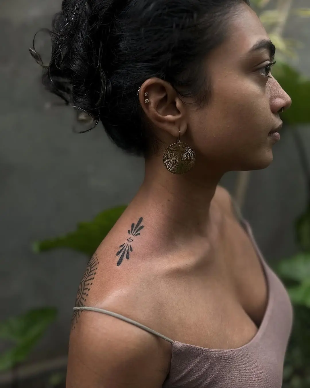 Elegant floral shoulder tattoo with minimalist design