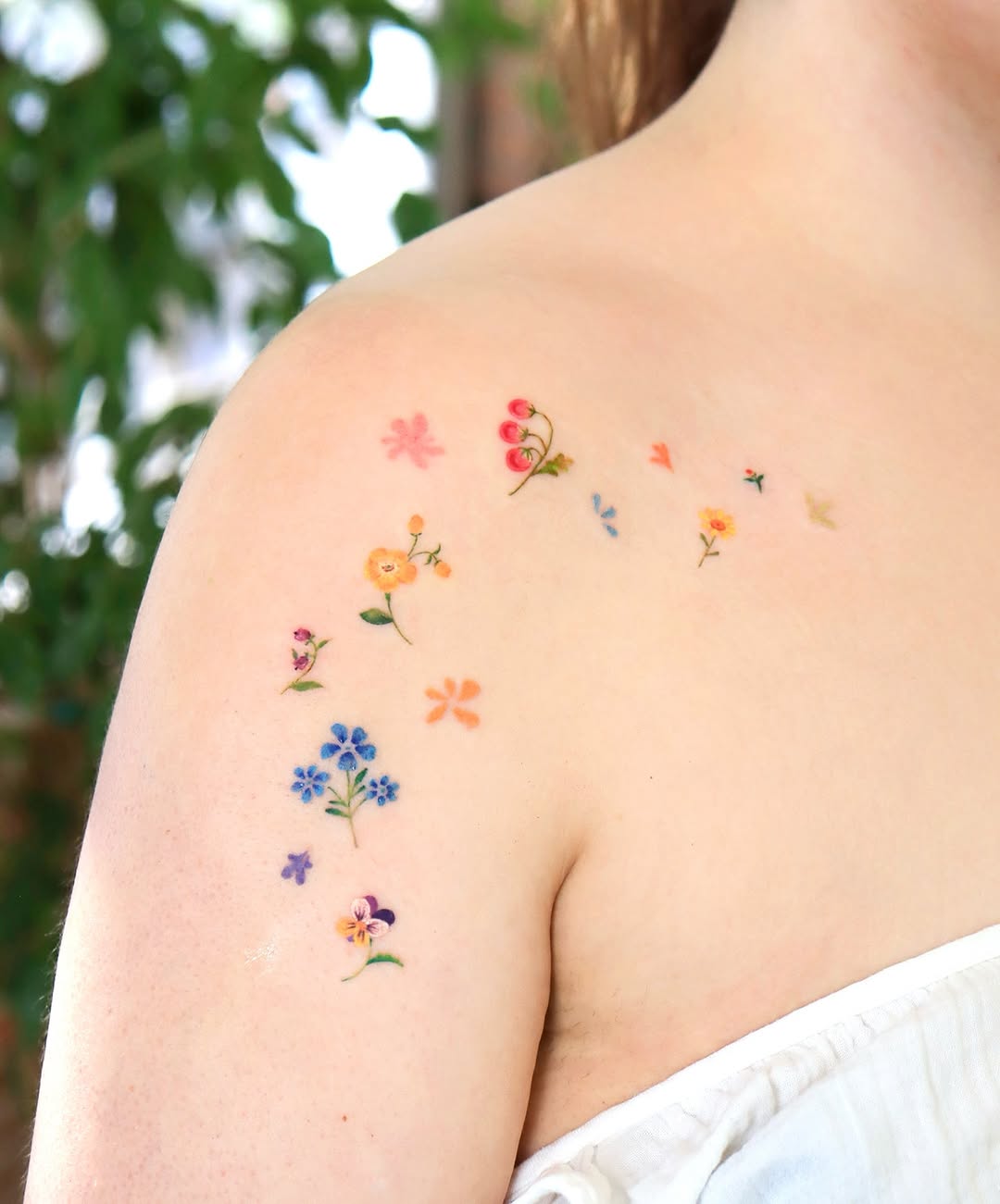 Delicate floral designs adorning the shoulder