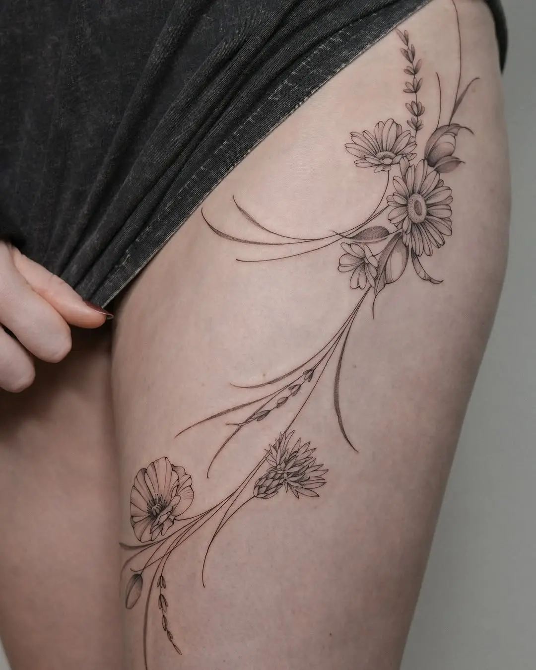 Elegant floral design for thigh tattoos