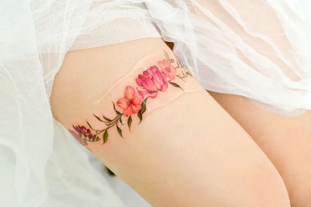 Beautiful Floral Thigh Tattoo in Vibrant Colors