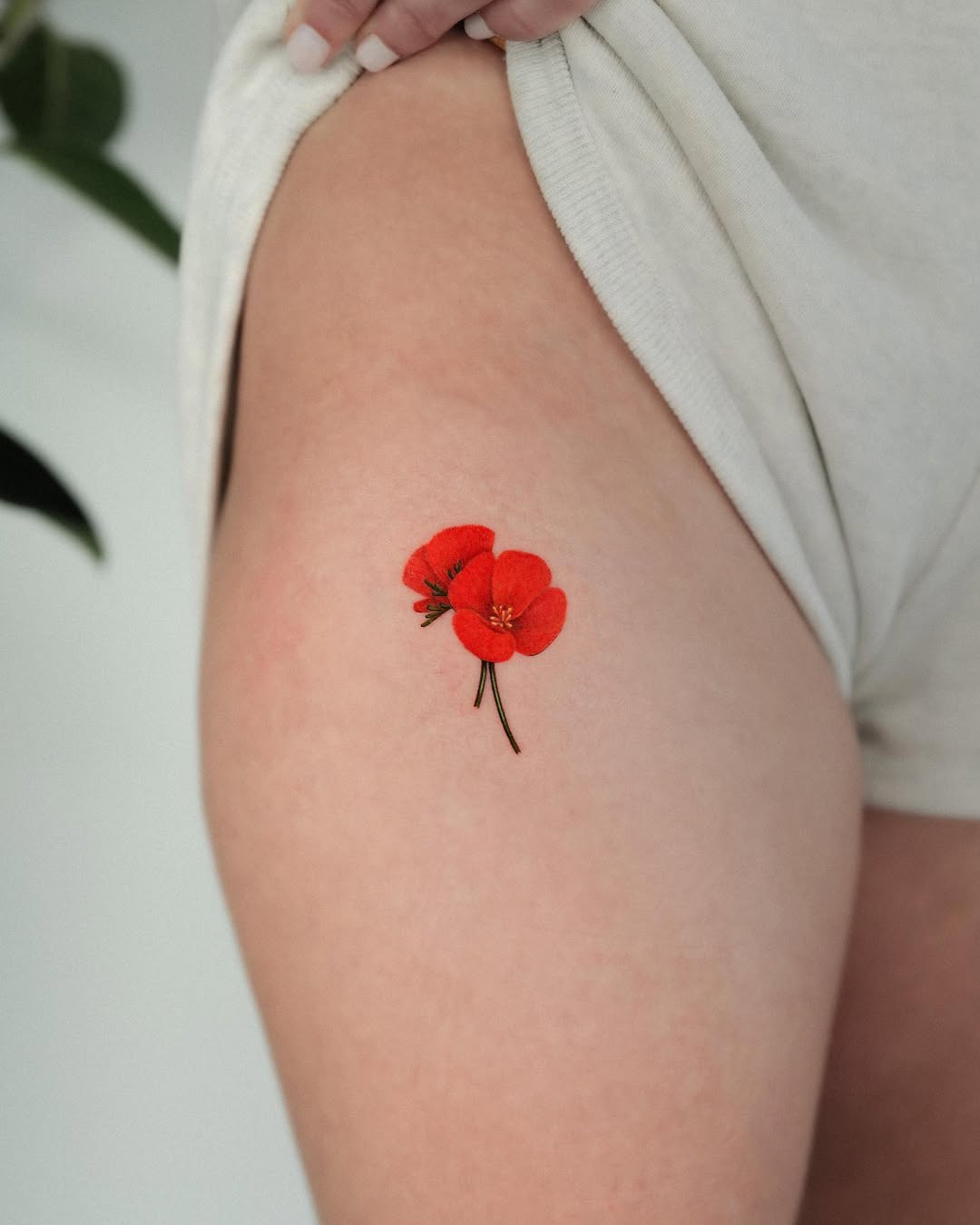 Vibrant Red Poppy Leg Tattoo Design