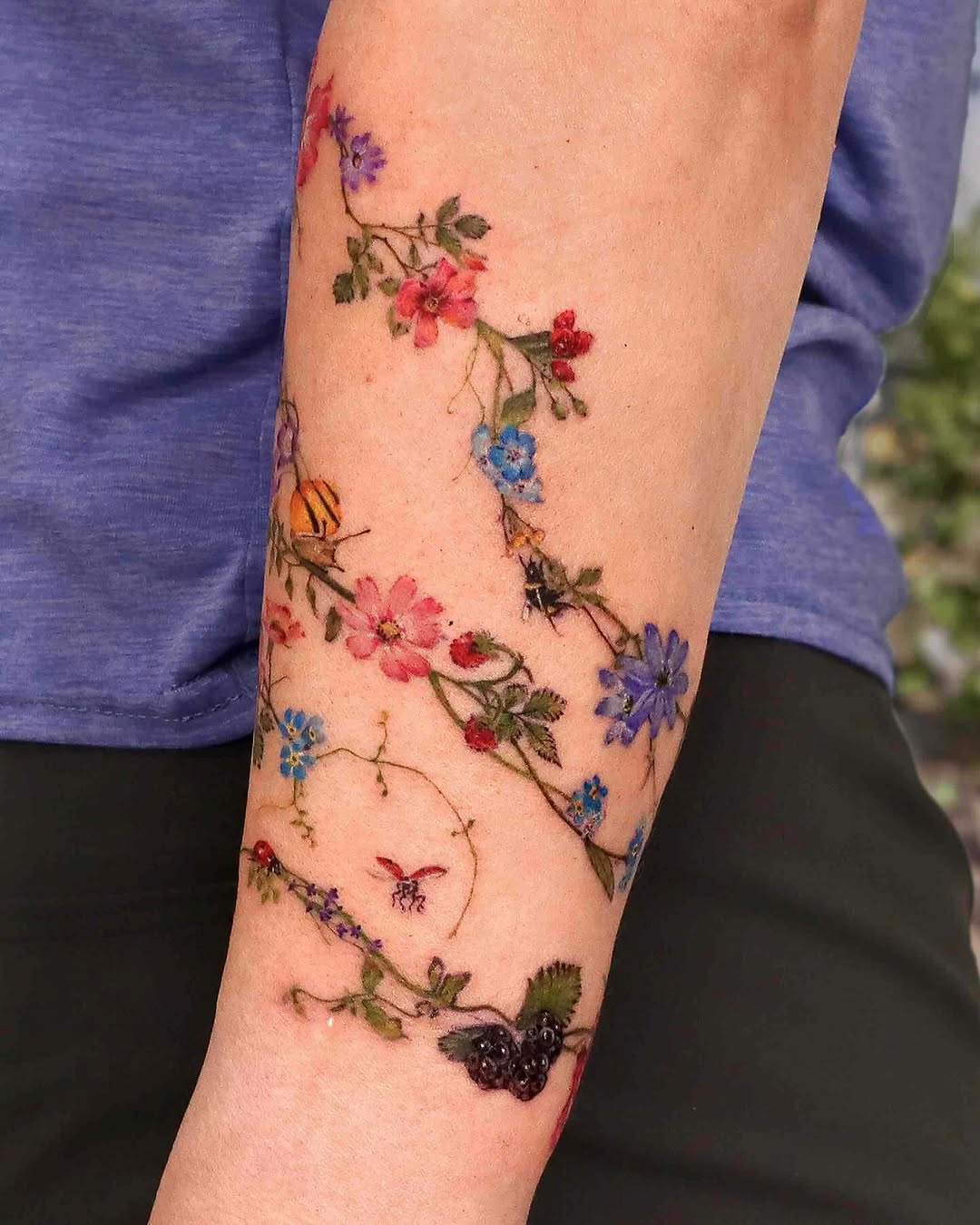 Stunning Floral and Butterfly Arm Tattoo Design