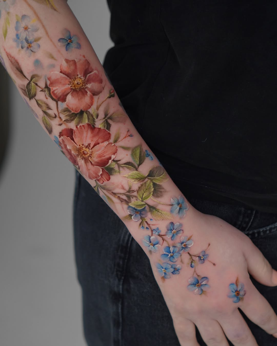 Vibrant Floral Tattoo Embracing the Arm