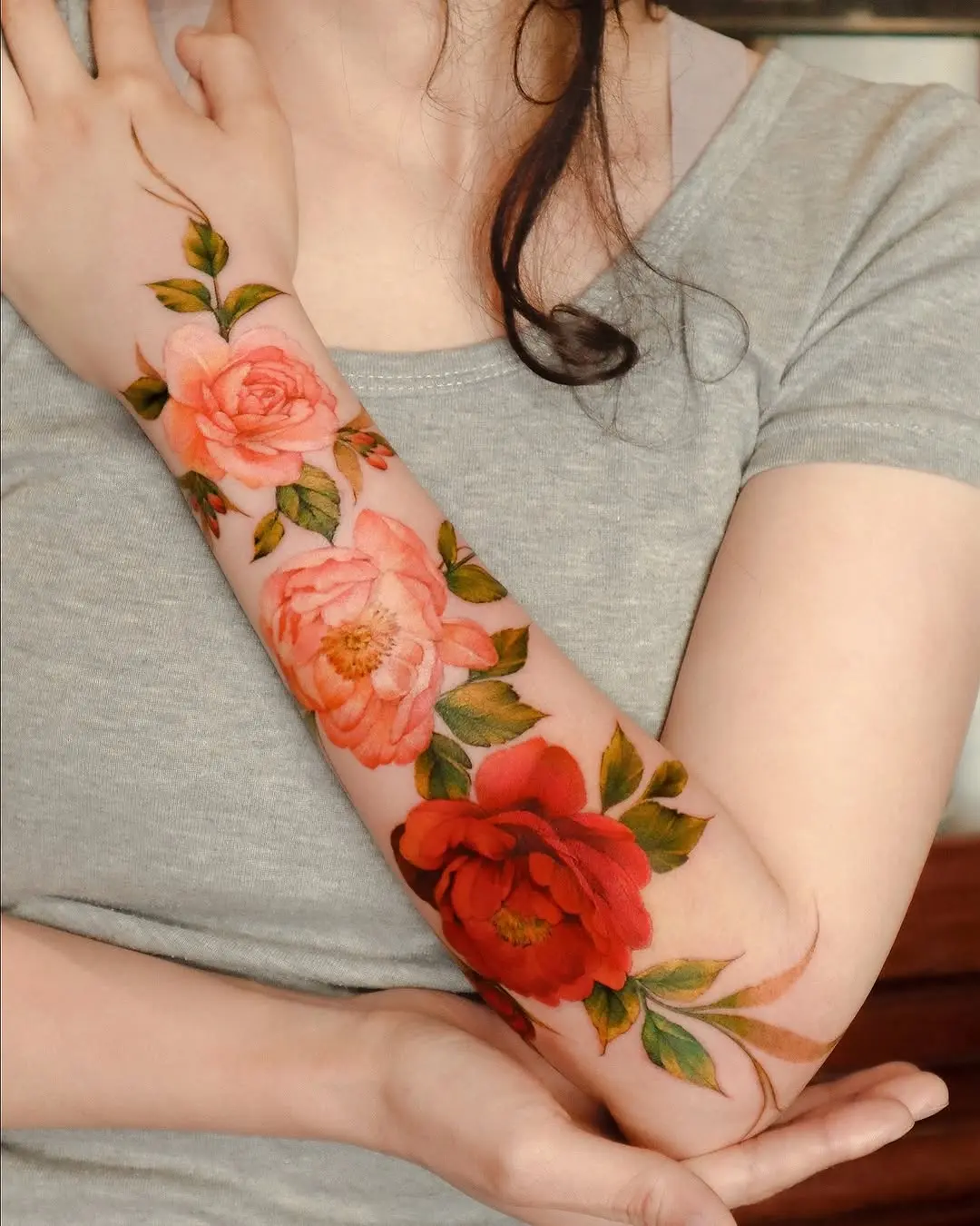 Stunning Floral Arm Tattoo Showcasing Roses
