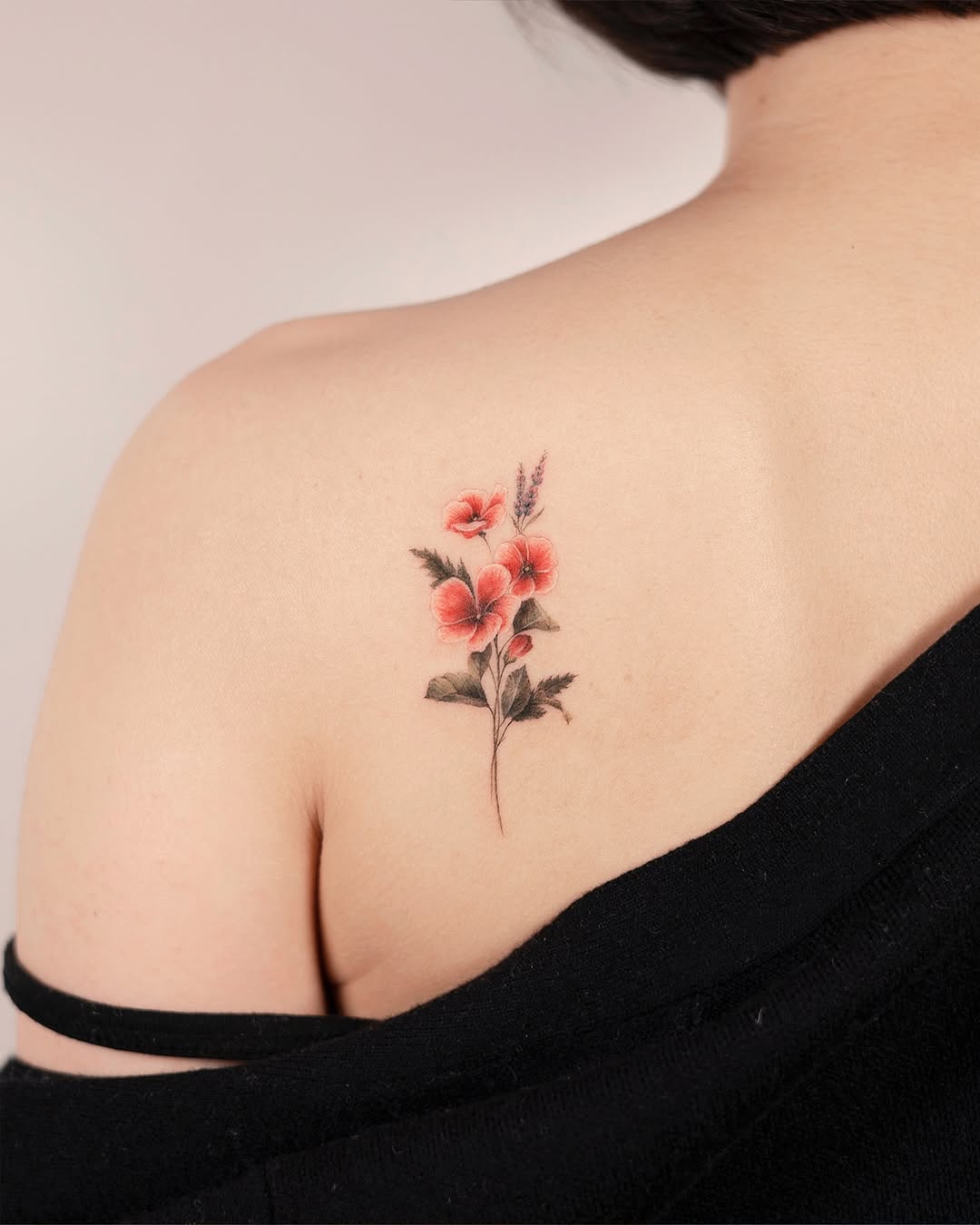 Delicate floral tattoo on bare skin