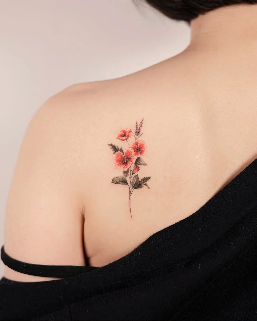 Delicate floral tattoo on bare skin