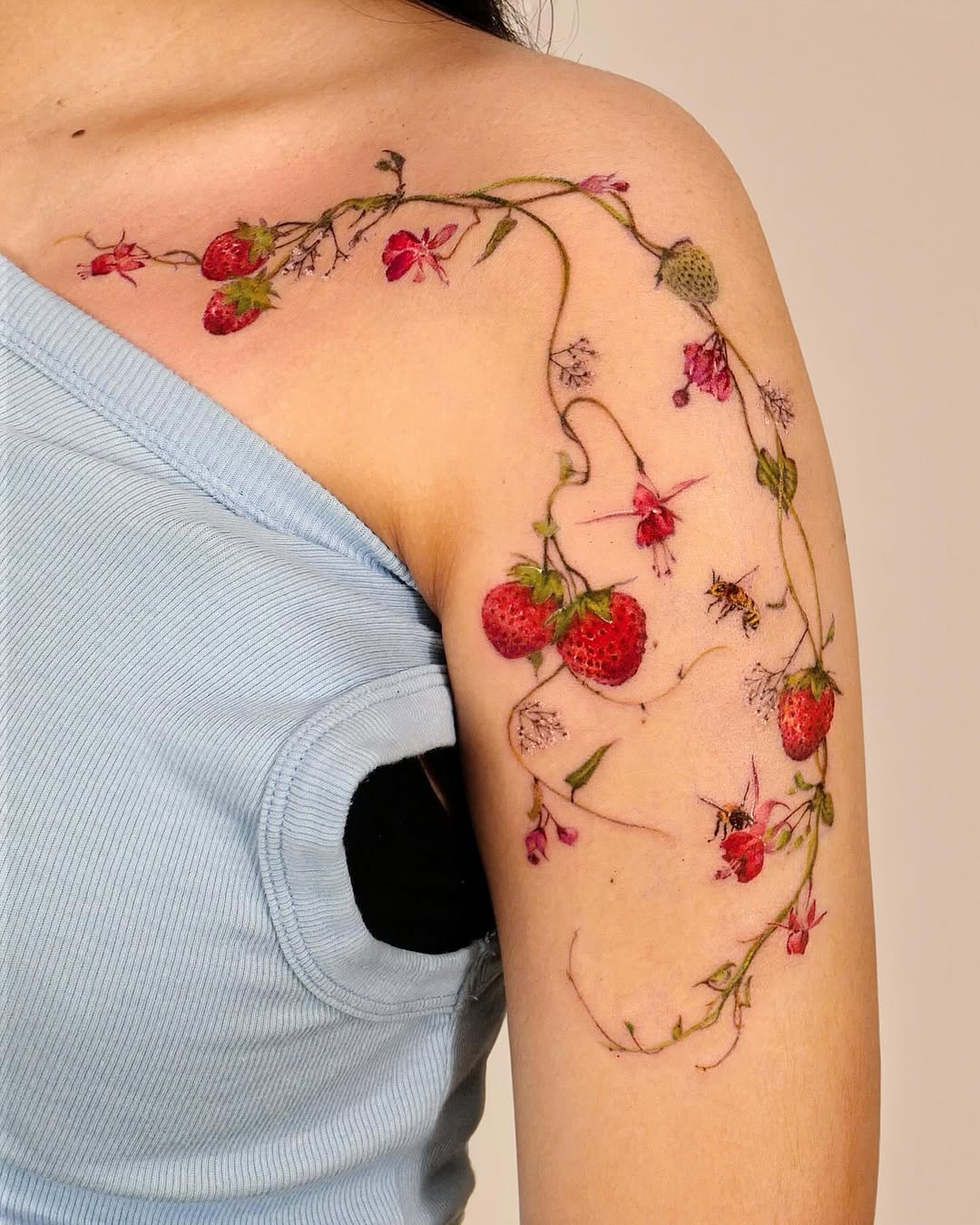 Whimsical Strawberry and Floral Arm Tattoo