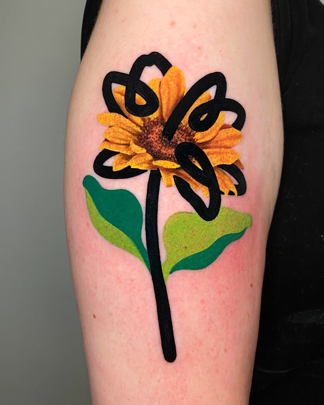 Artistic sunflower tattoo with bold outlines