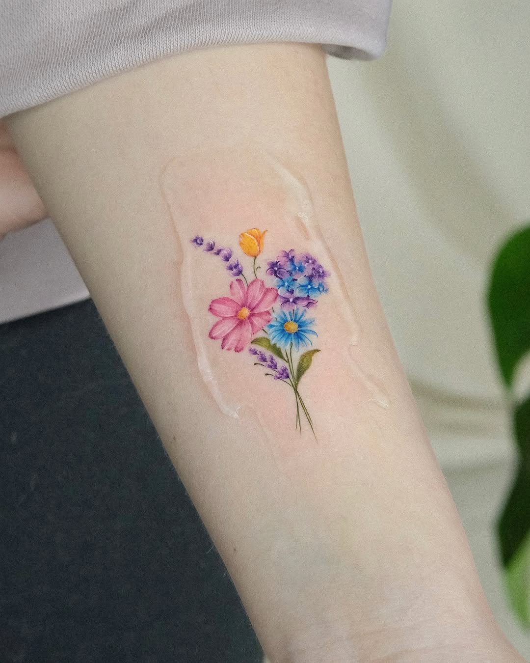 Delicate and Vibrant Floral Tattoo Design
