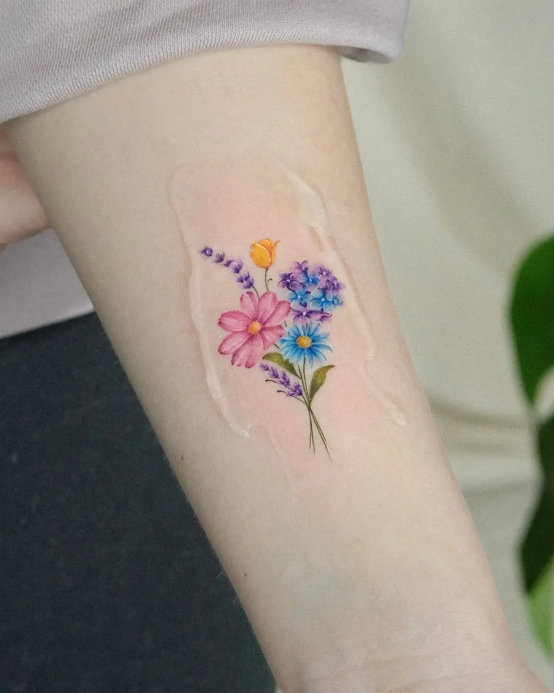 Delicate and Vibrant Floral Tattoo Design