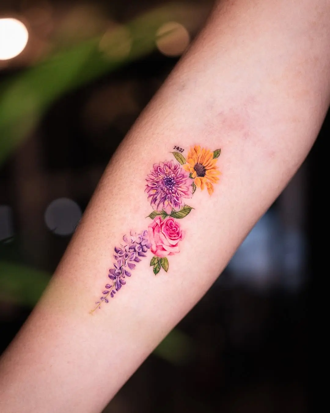 Vibrant Floral Tattoos on the Forearm