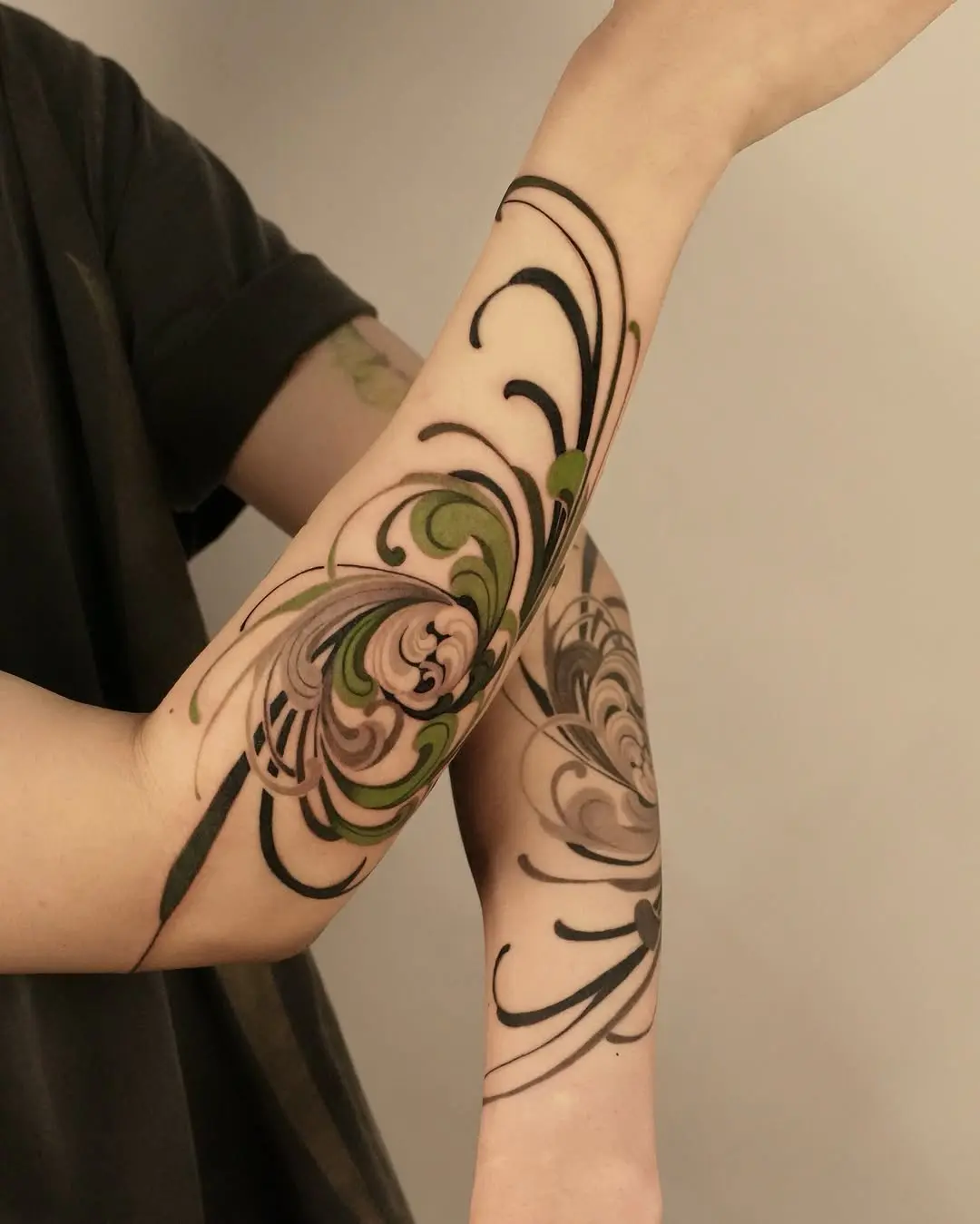 Elegant spiral flower tattoos on forearm
