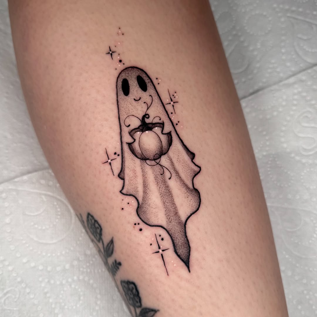 Charming ghost tattoo with heart design