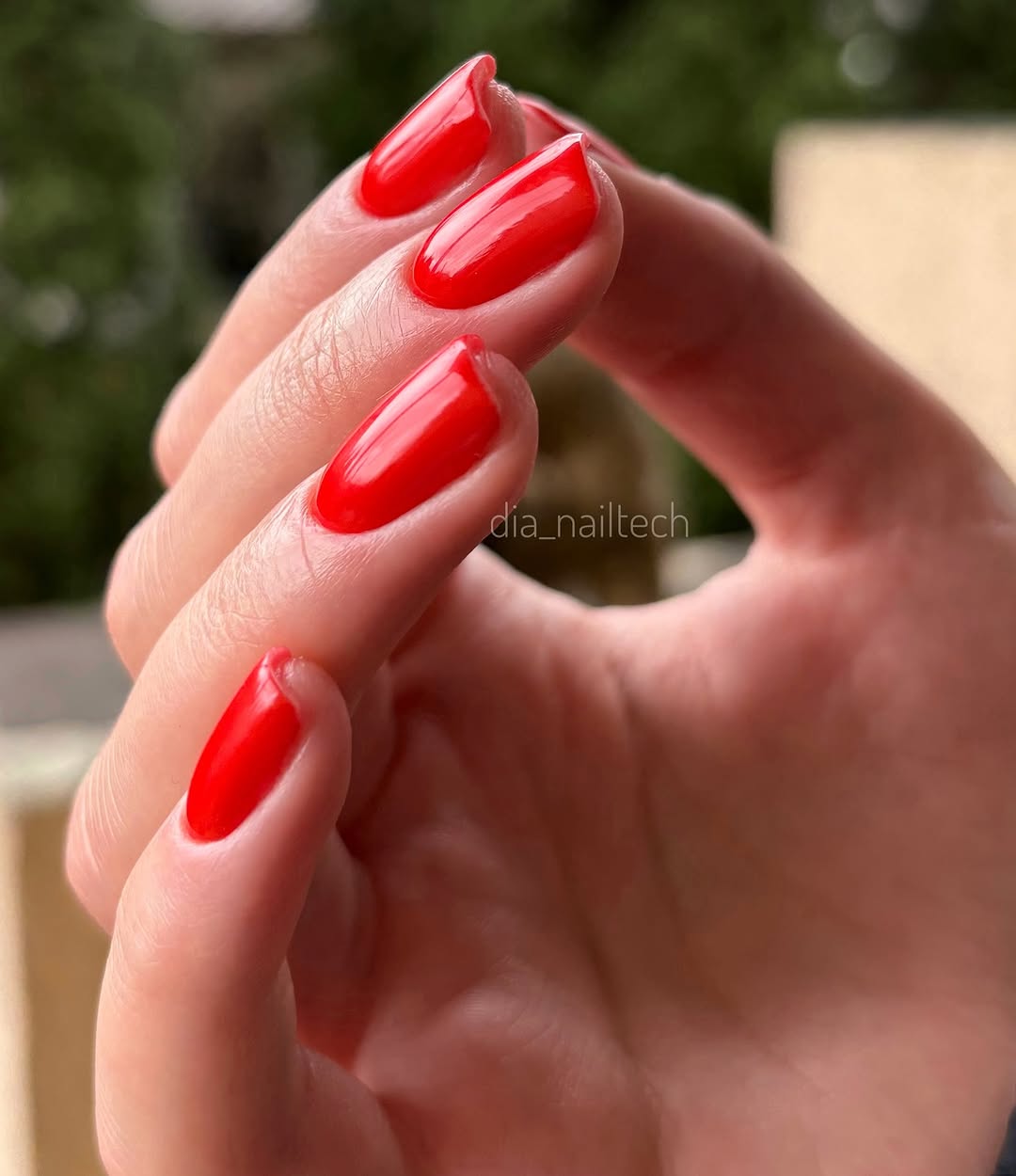 Vibrant and glossy red nail design aesthetic