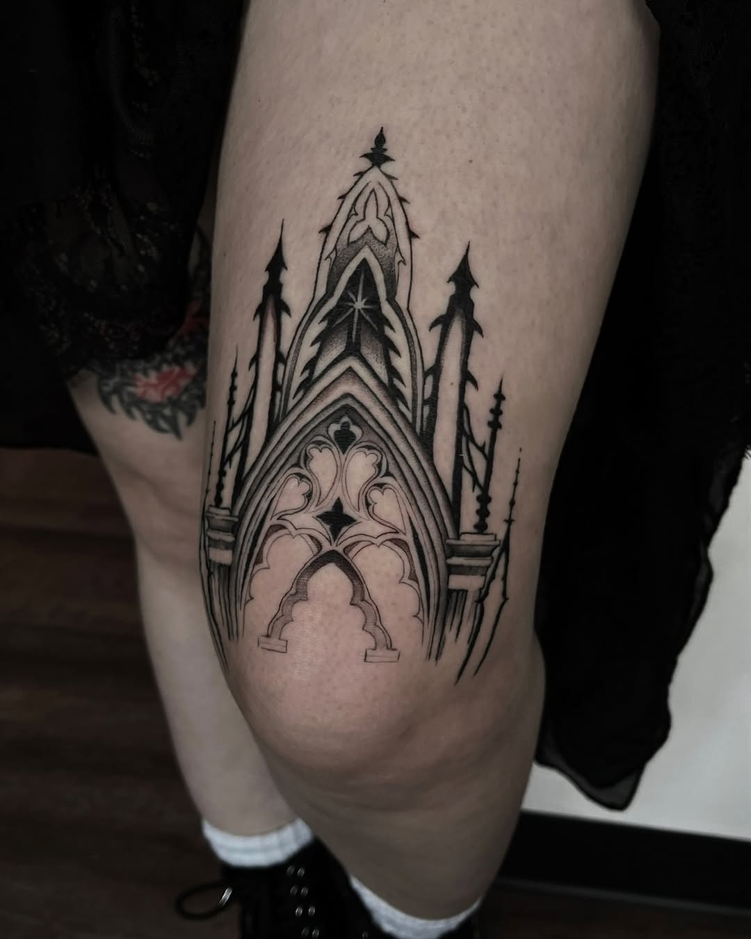 Stunning Gothic-Inspired Thigh Tattoo Design