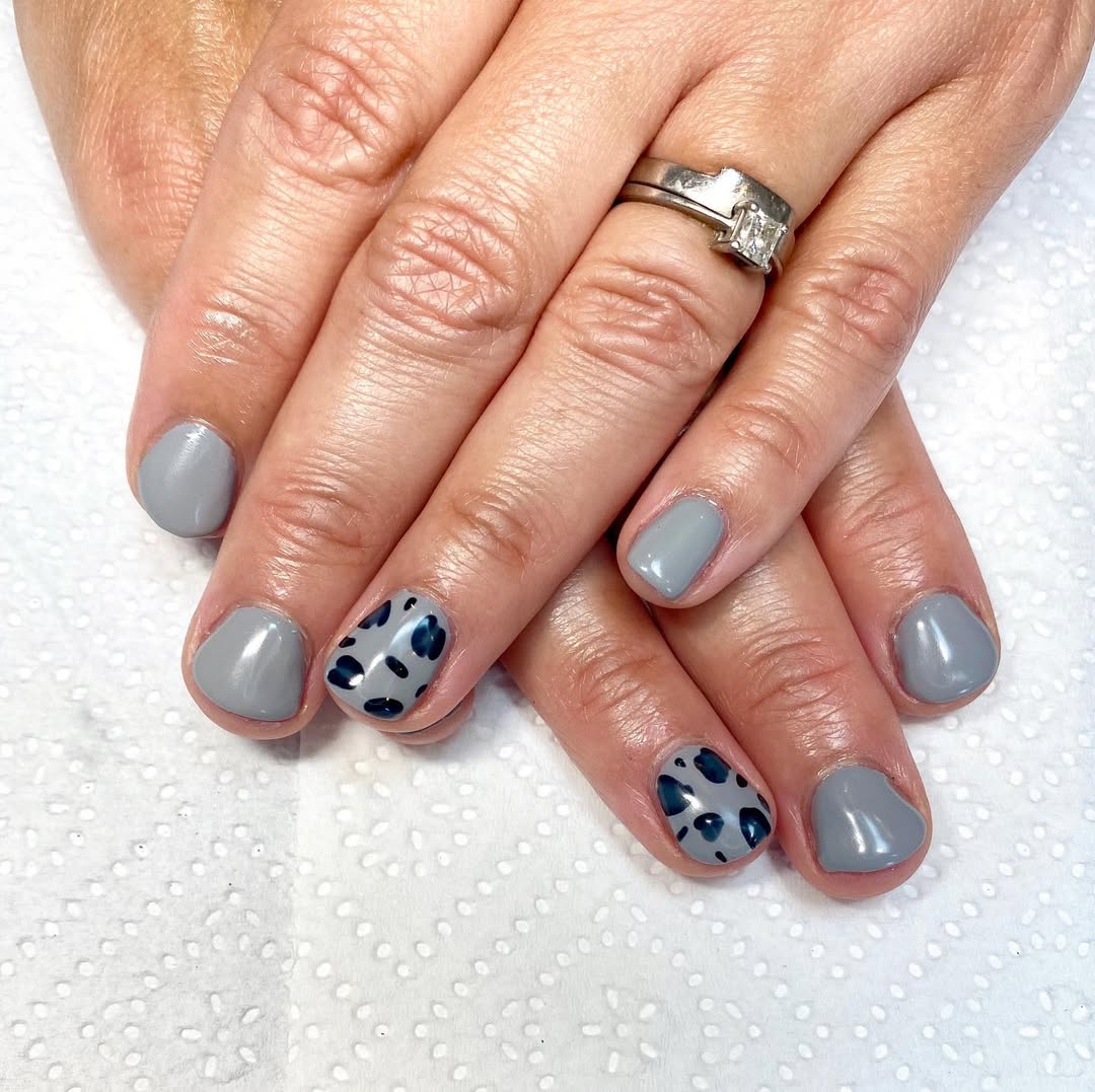 Chic grey nails with bold leopard accents