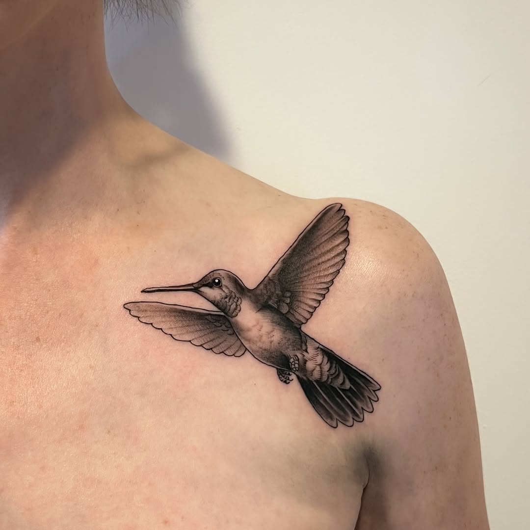 Stunning hummingbird tattoo on the shoulder