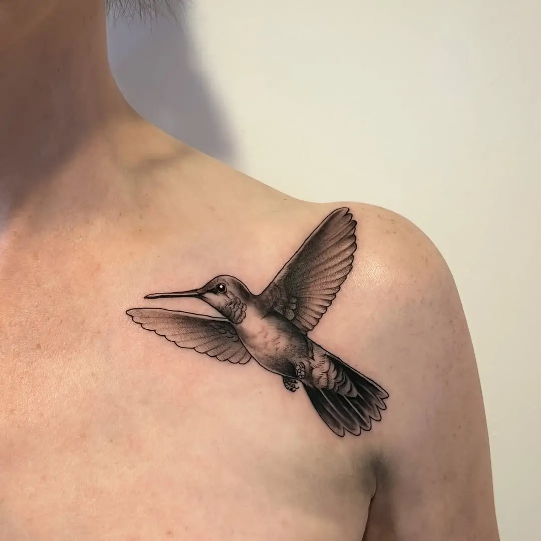 Stunning hummingbird tattoo on the shoulder