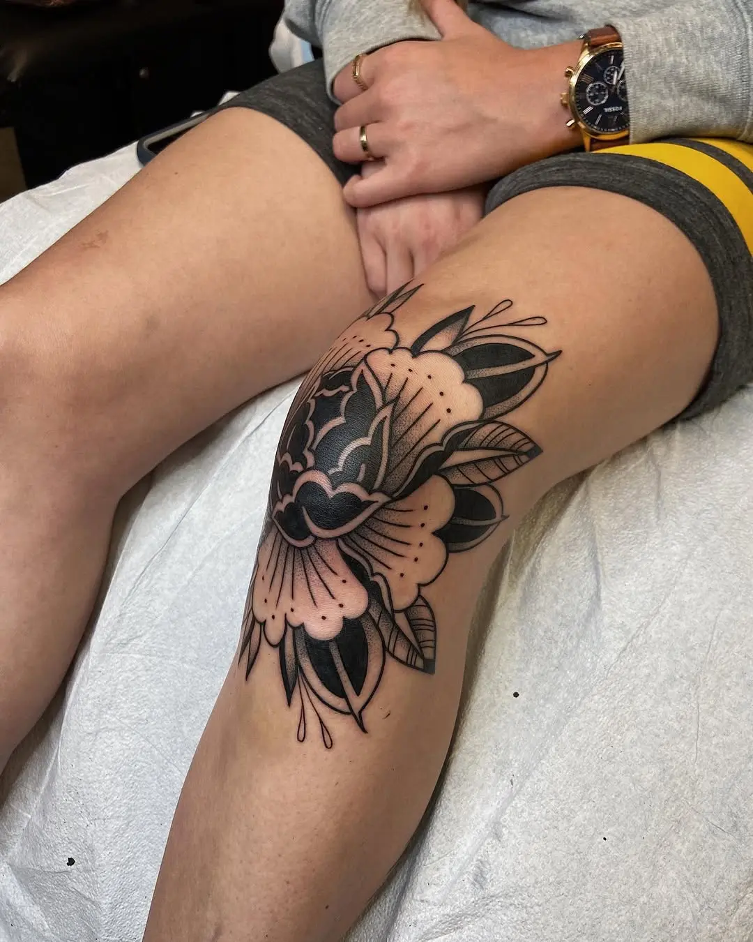Intricate floral knee tattoo design detail