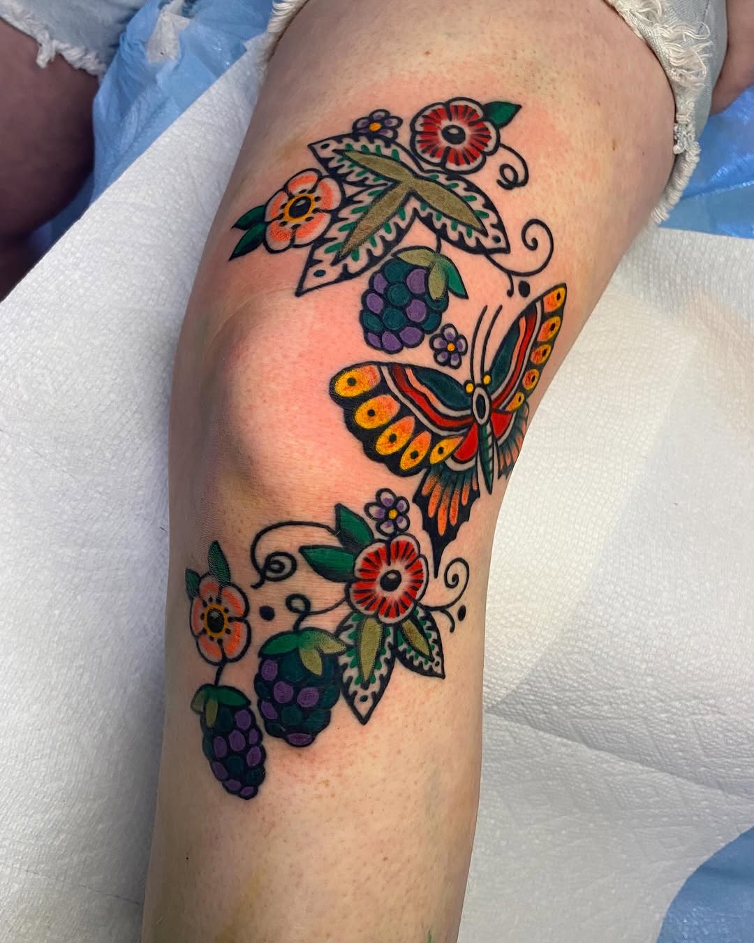 Colorful Floral Butterfly Knee Tattoo Design