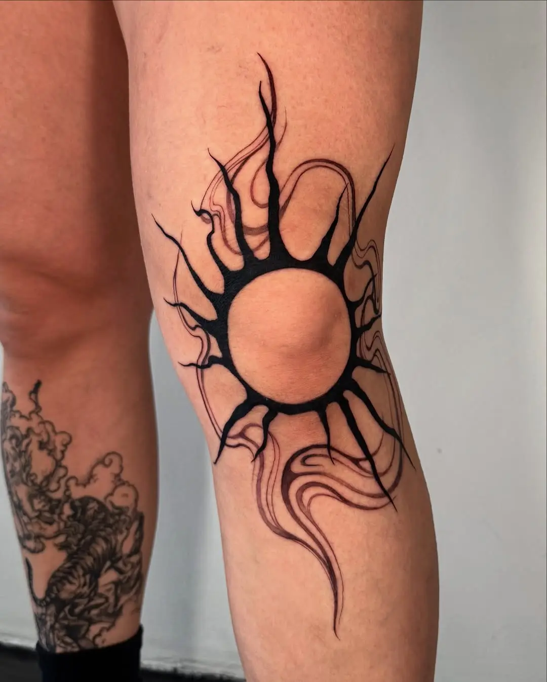 Bold sun tattoo radiating unique energy
