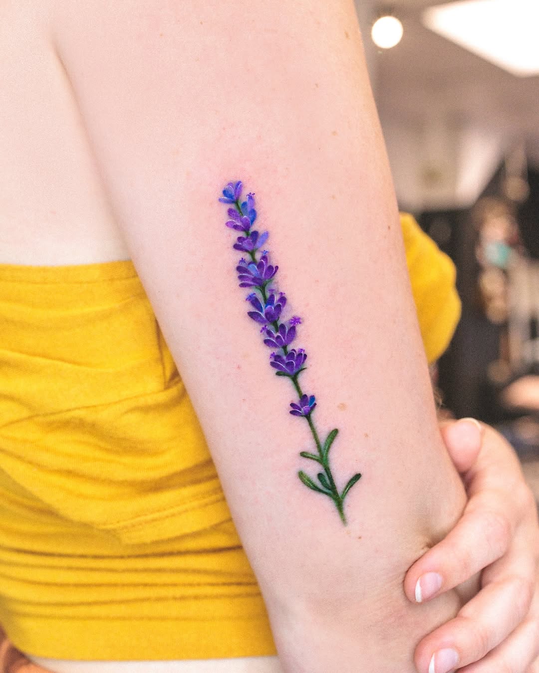 Elegant lavender tattoo accentuating the arm