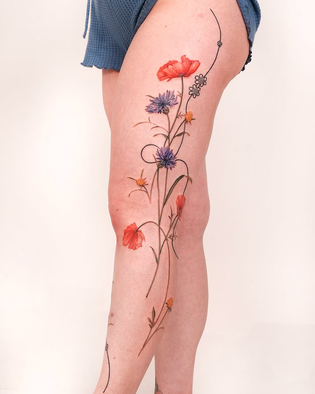 Vibrant floral leg tattoos for a nature-inspired vibe