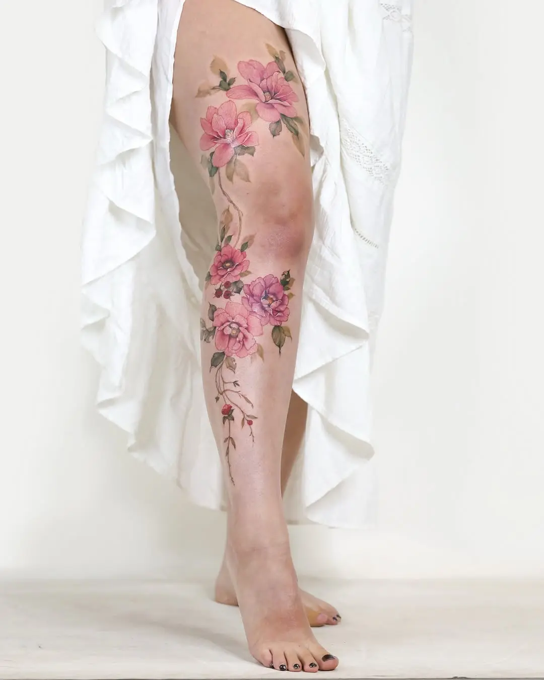 Vibrant Floral Leg Tattoo for a Unique Style