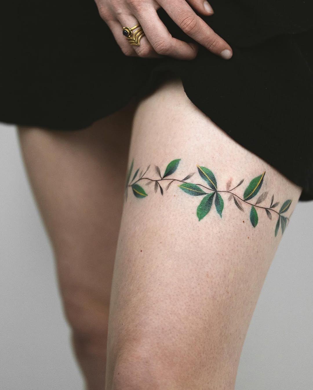 Elegant floral tattoo design on the thigh