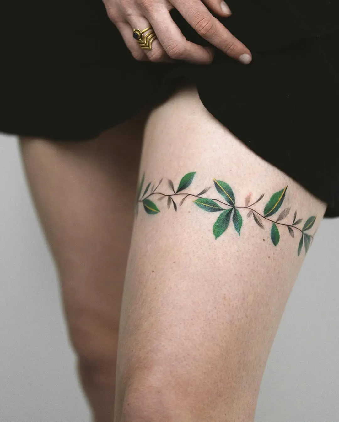 Elegant floral tattoo design on the thigh