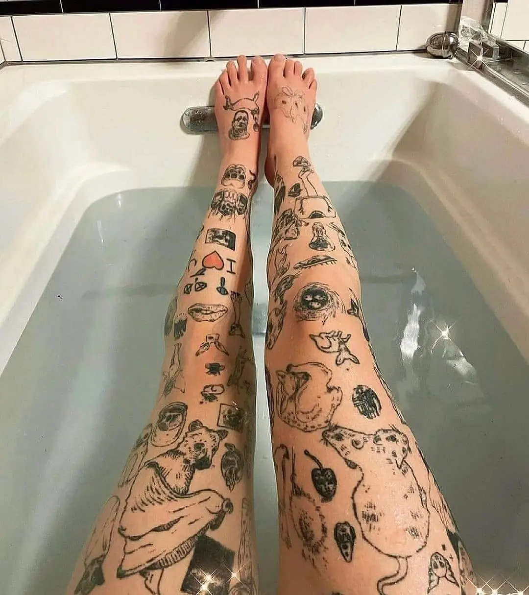 Stunning Showcase of Leg Tattoos in Bathtub