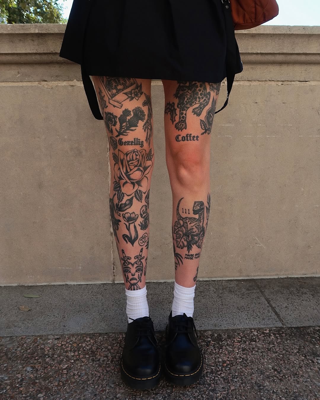 Intricate floral and text leg tattoos design