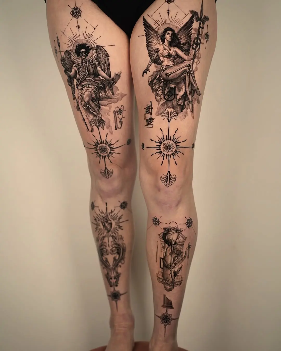 Intricate leg tattoos with mystical themes