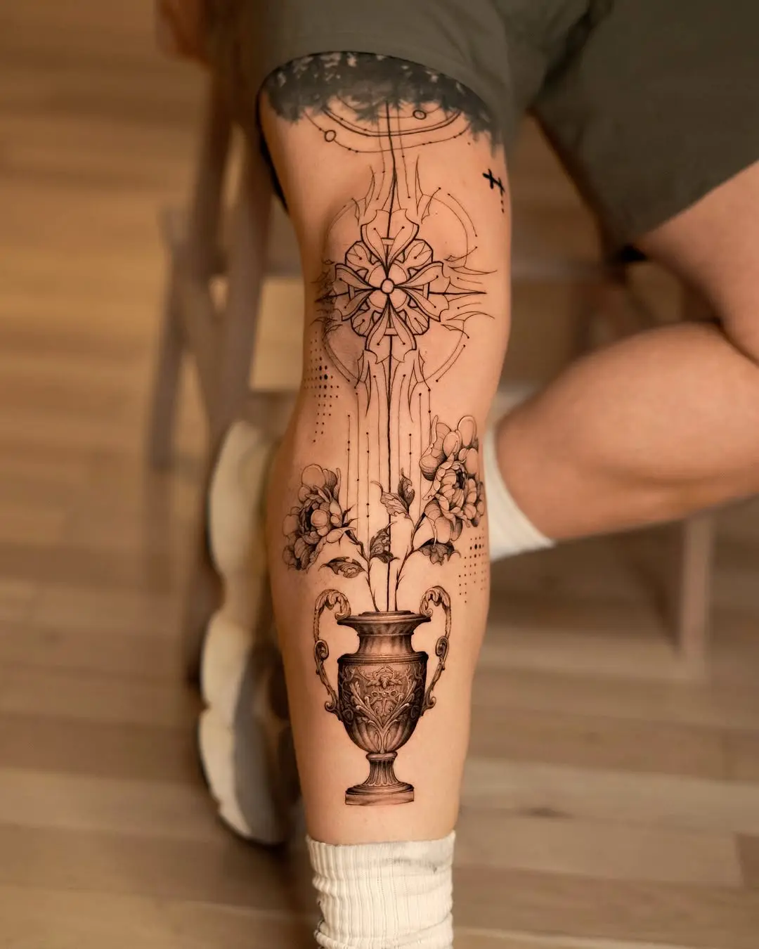 Exquisite floral vase leg tattoo design