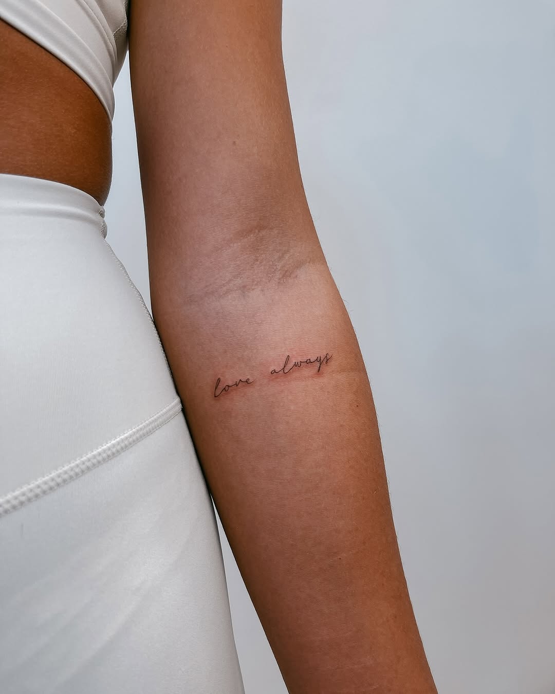 Elegant minimalistic tattoo capturing timeless love