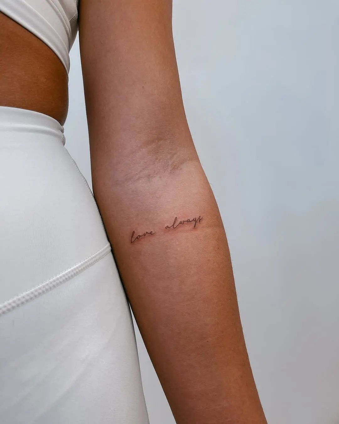 Elegant minimalistic tattoo capturing timeless love