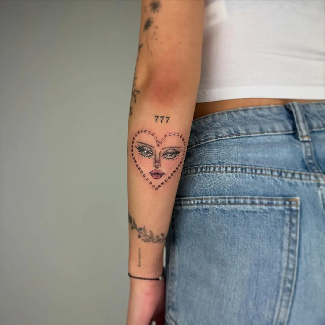Unique heart-shaped face tattoo design