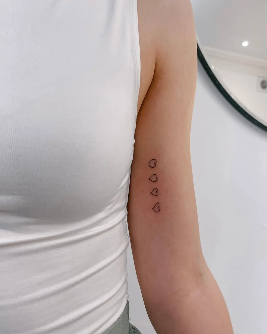 Minimalist hearts inked in delicate lines