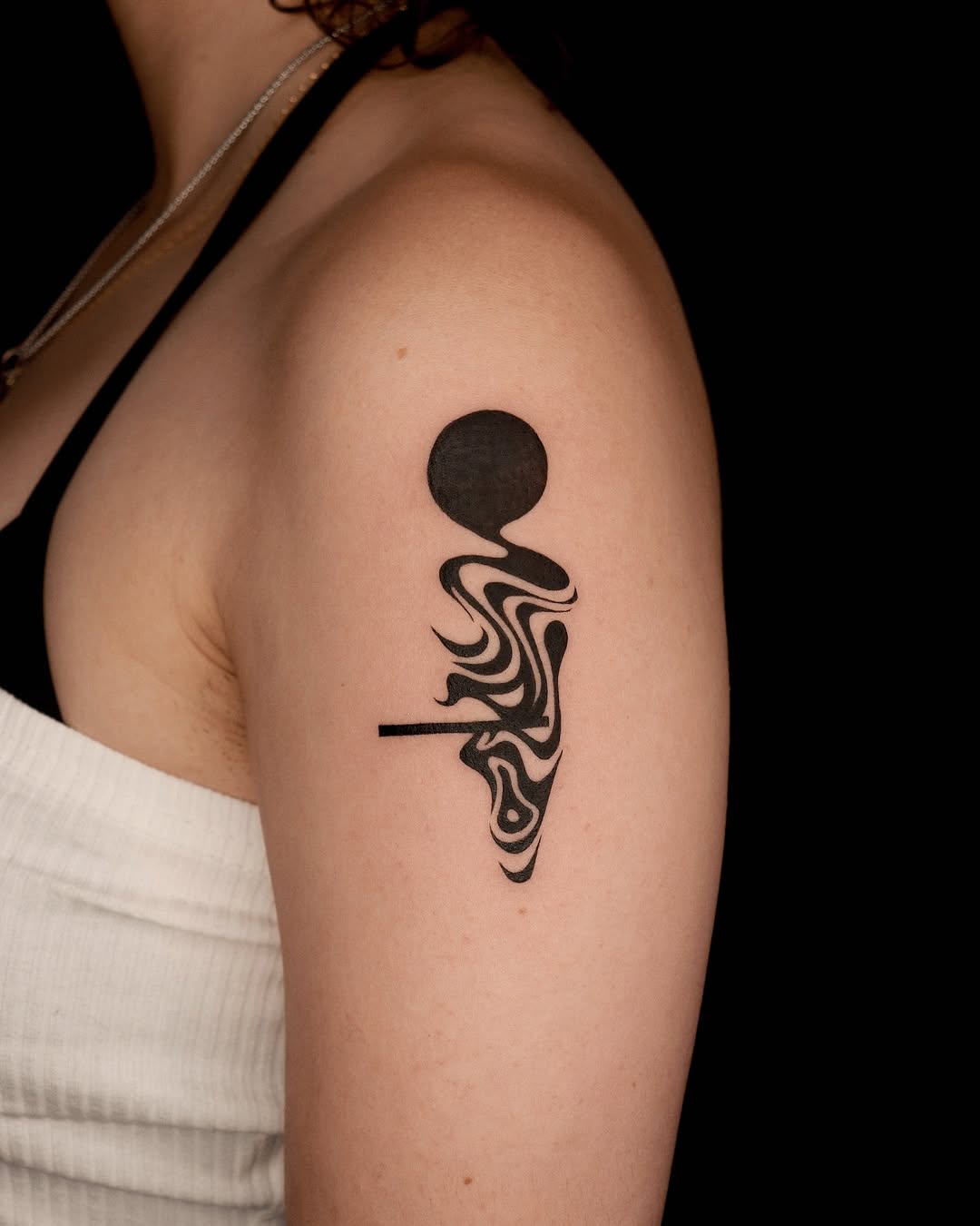 Flowing patterns in a minimalist tattoo design