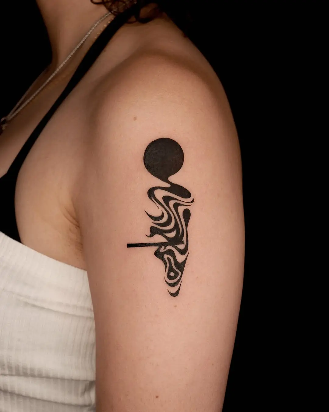 Flowing patterns in a minimalist tattoo design