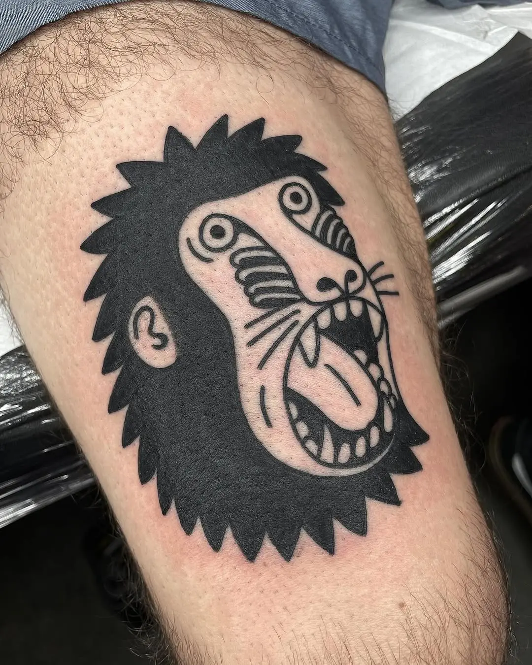 Bold Black Monkey Tattoo with Unique Features