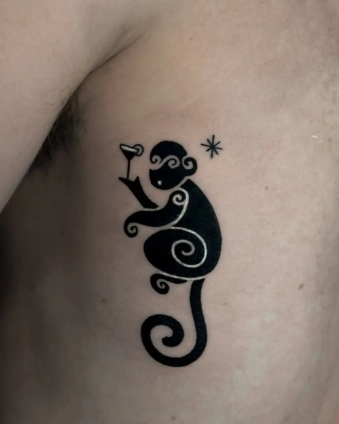 Stylish monkey tattoo with a drink in hand
