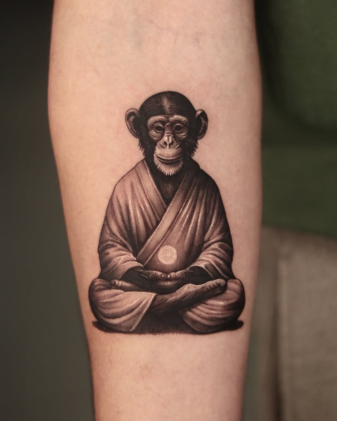 A peaceful monkey tattoo embodying tranquility