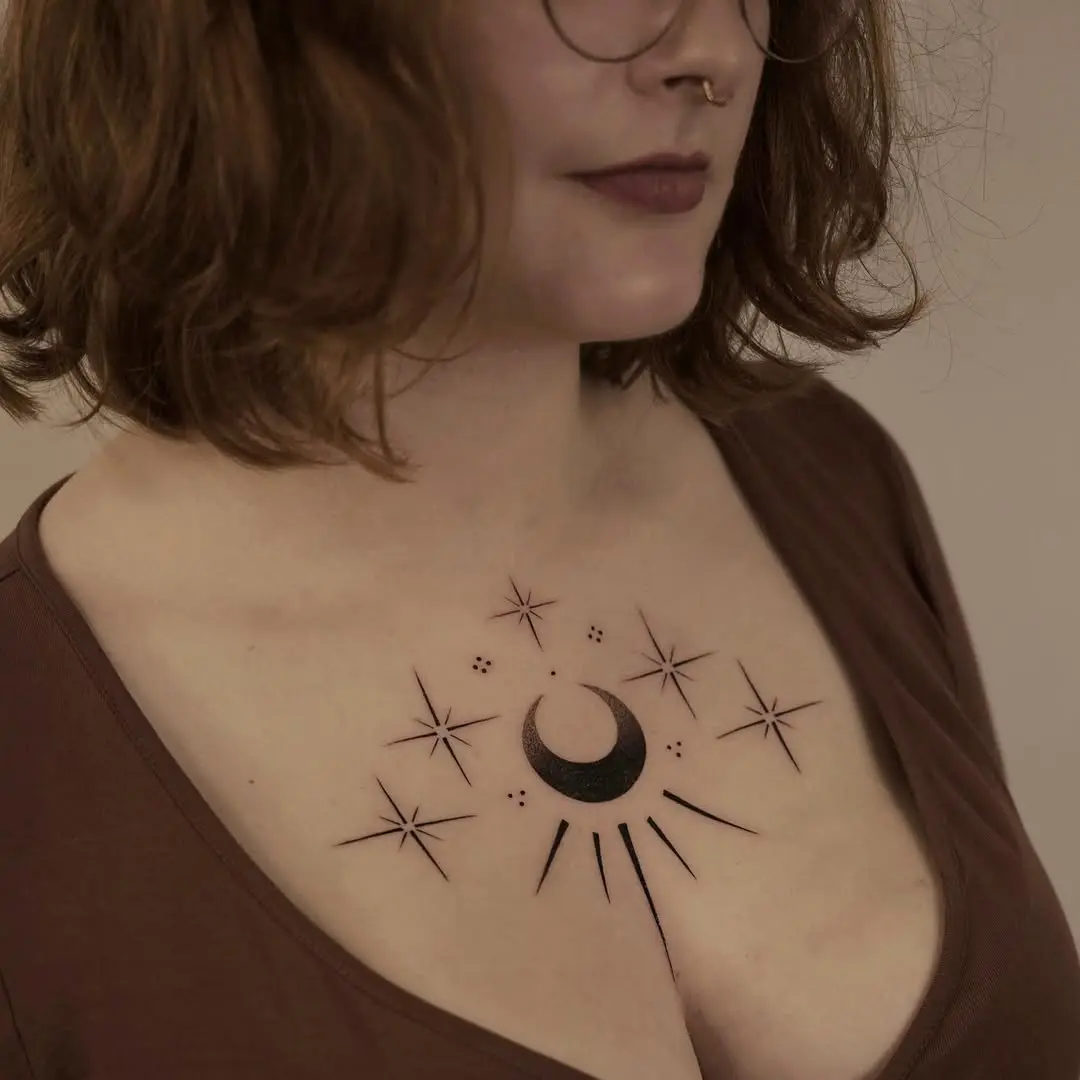 Elegant moon and star chest tattoo design