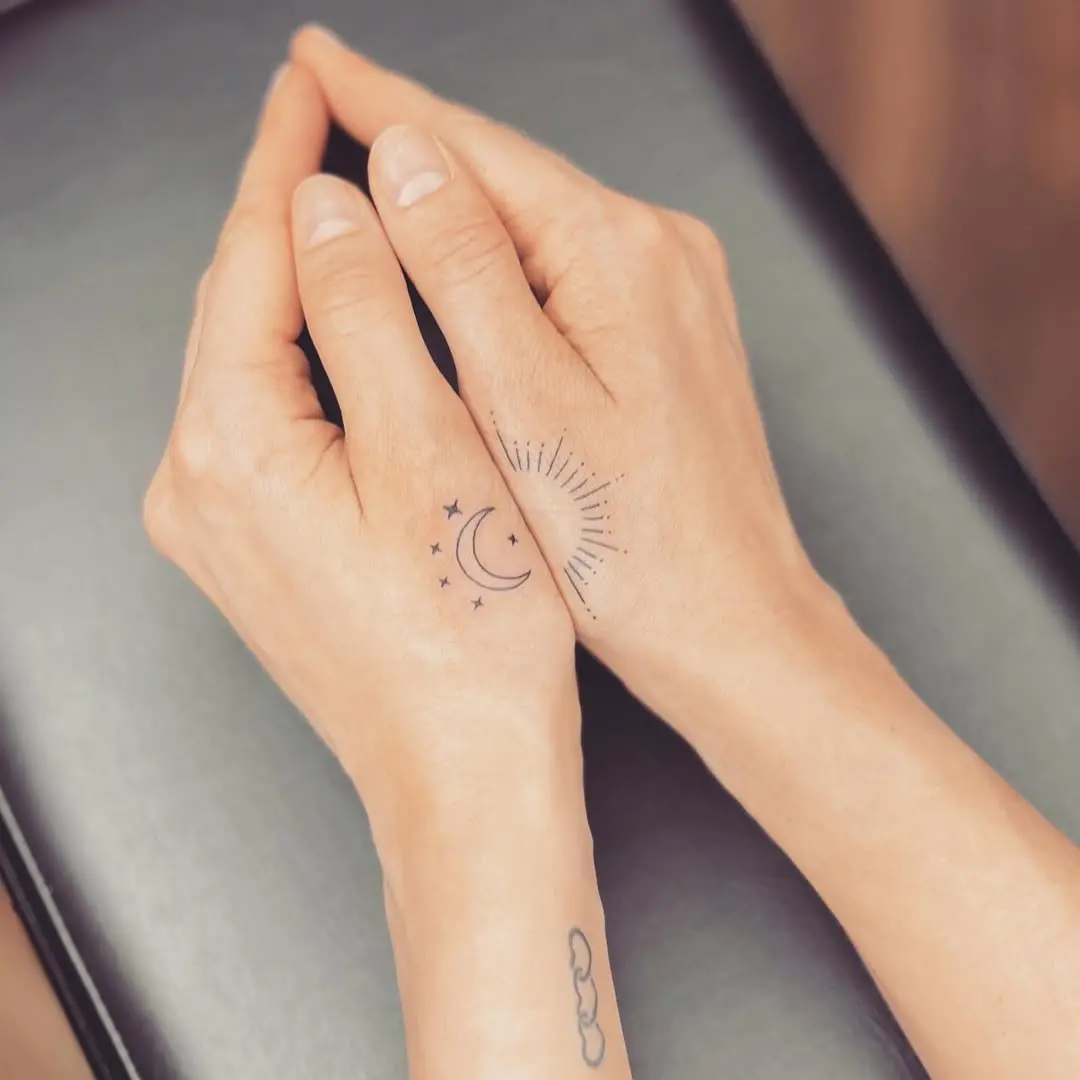 Elegant Sun and Moon Hand Tattoos
