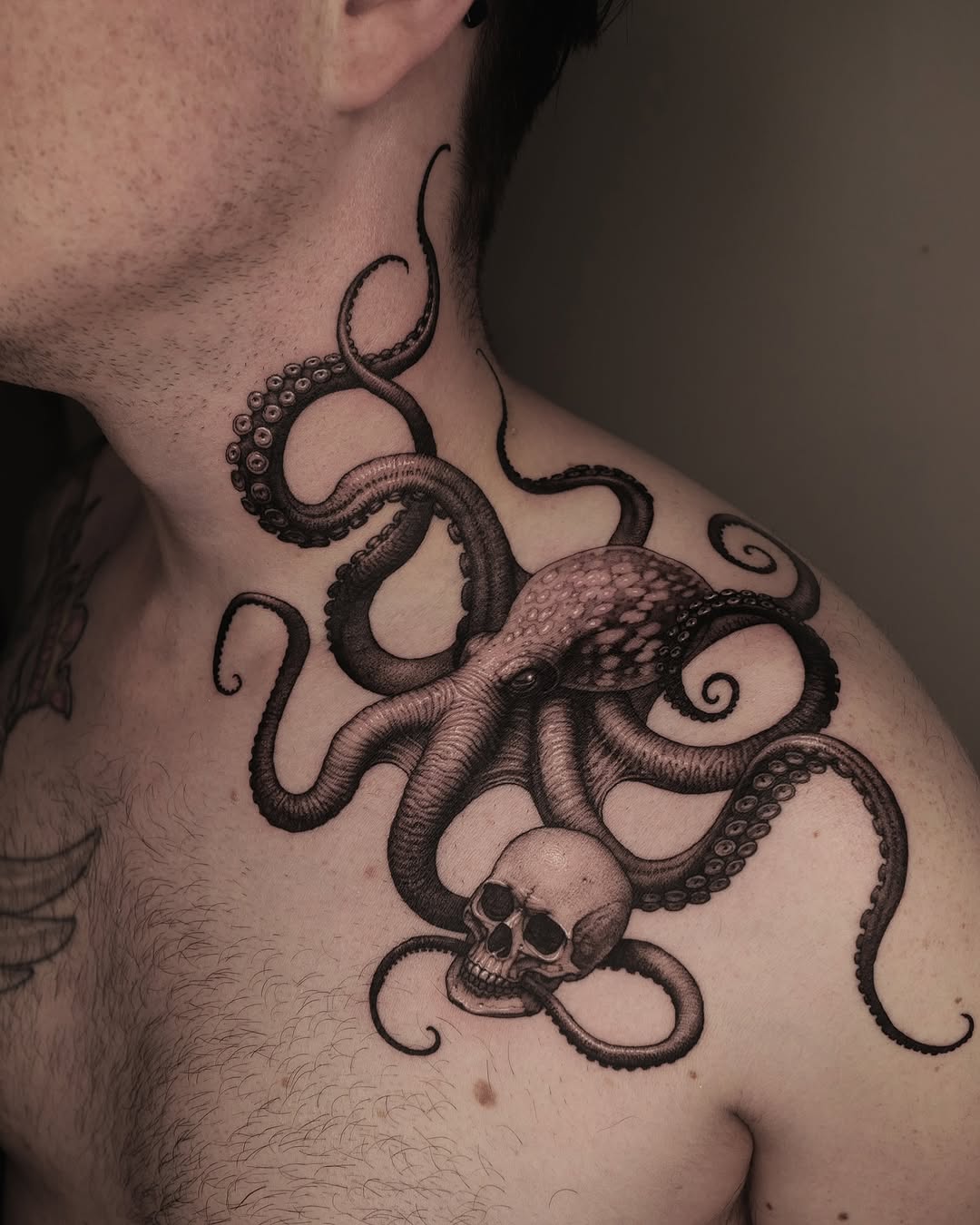 Intricate octopus and skull shoulder tattoo design