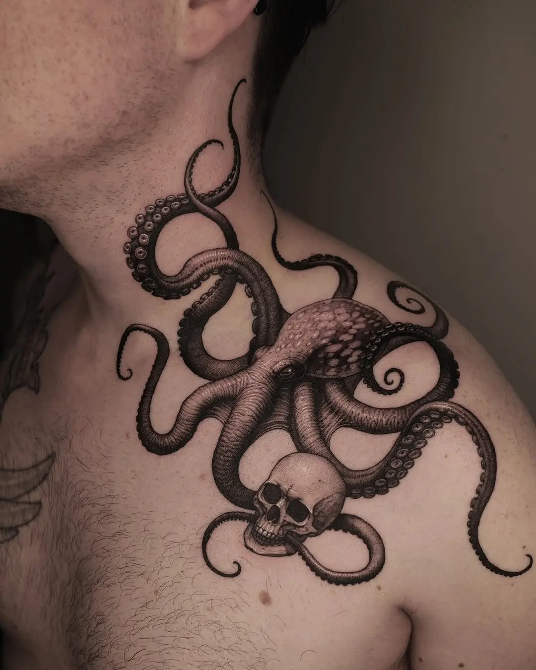 Intricate octopus and skull shoulder tattoo design